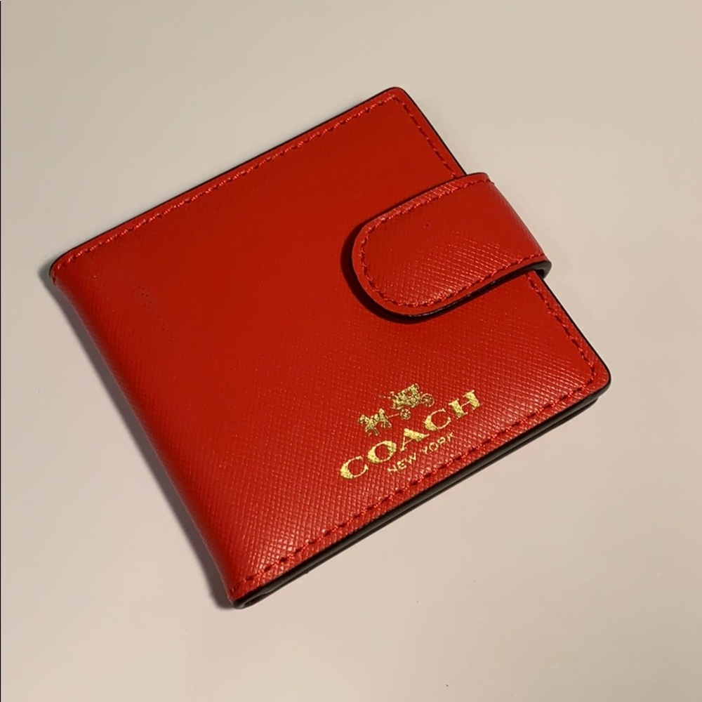 Coach bifold clutch mirror